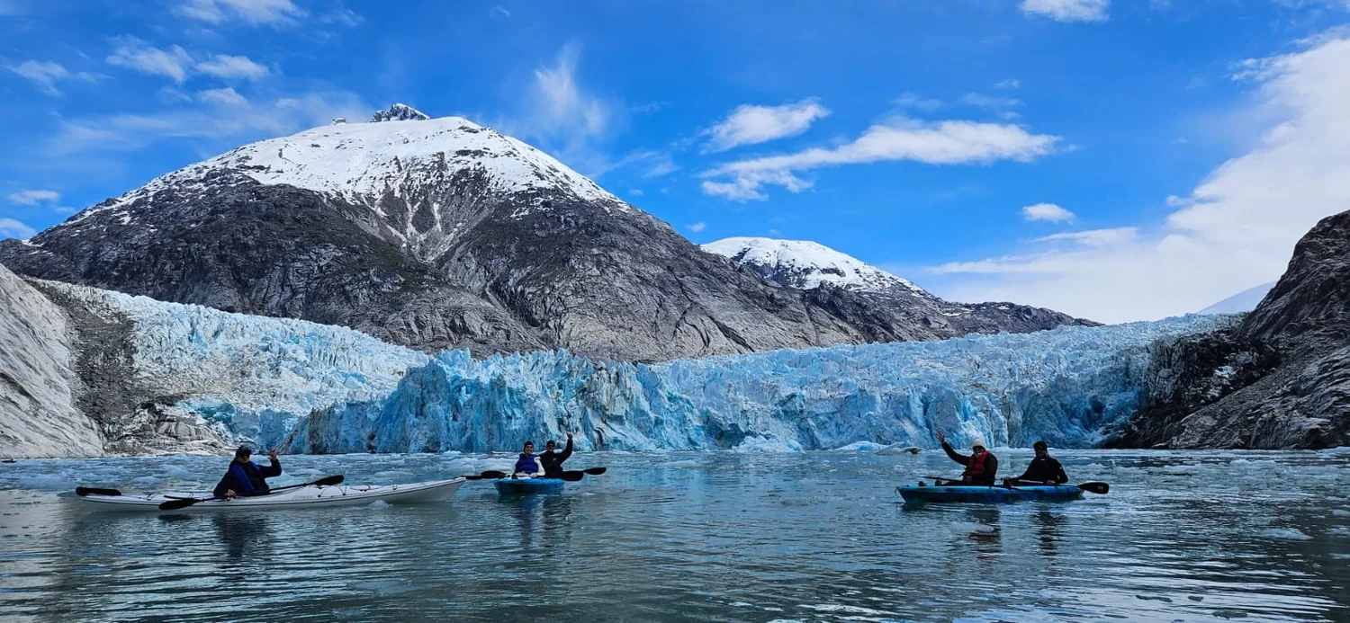 Guests kayaking at a tidewater glacier, Southeast Alaska
