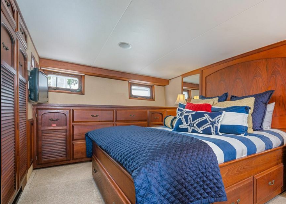 Master stateroom with queen bed and teak cabinetry aboard M/Y Oceana