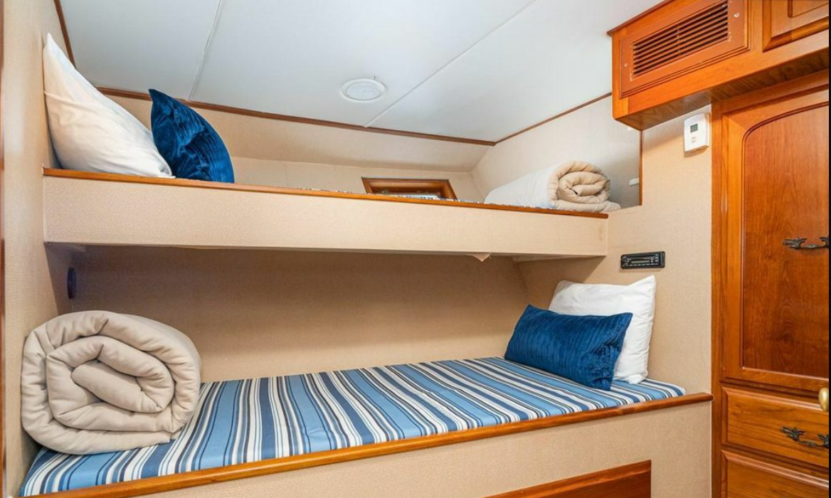 Bunk room with two single berths aboard M/Y Oceana
