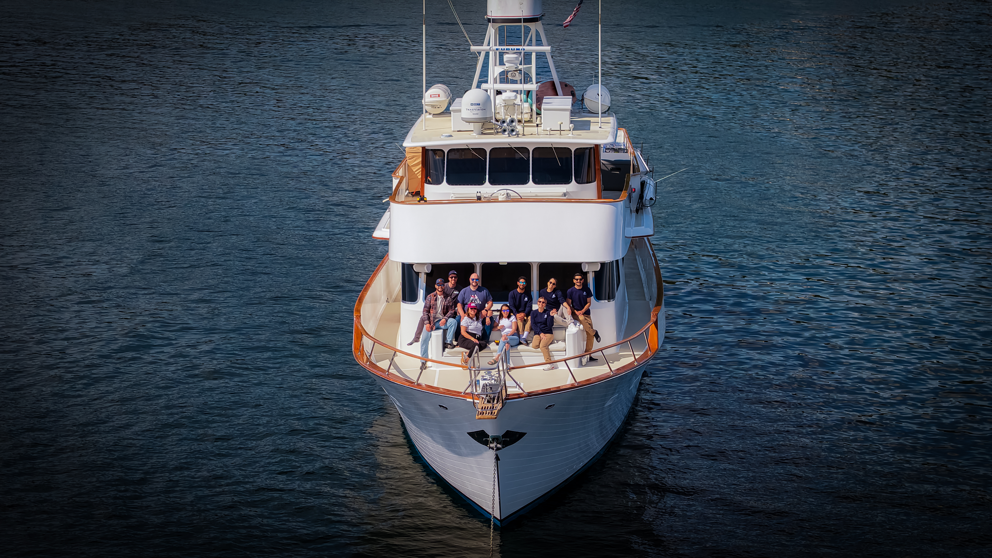 Motor Yacht Oceana with crew and guests on the foredeck, Southeast Alaska